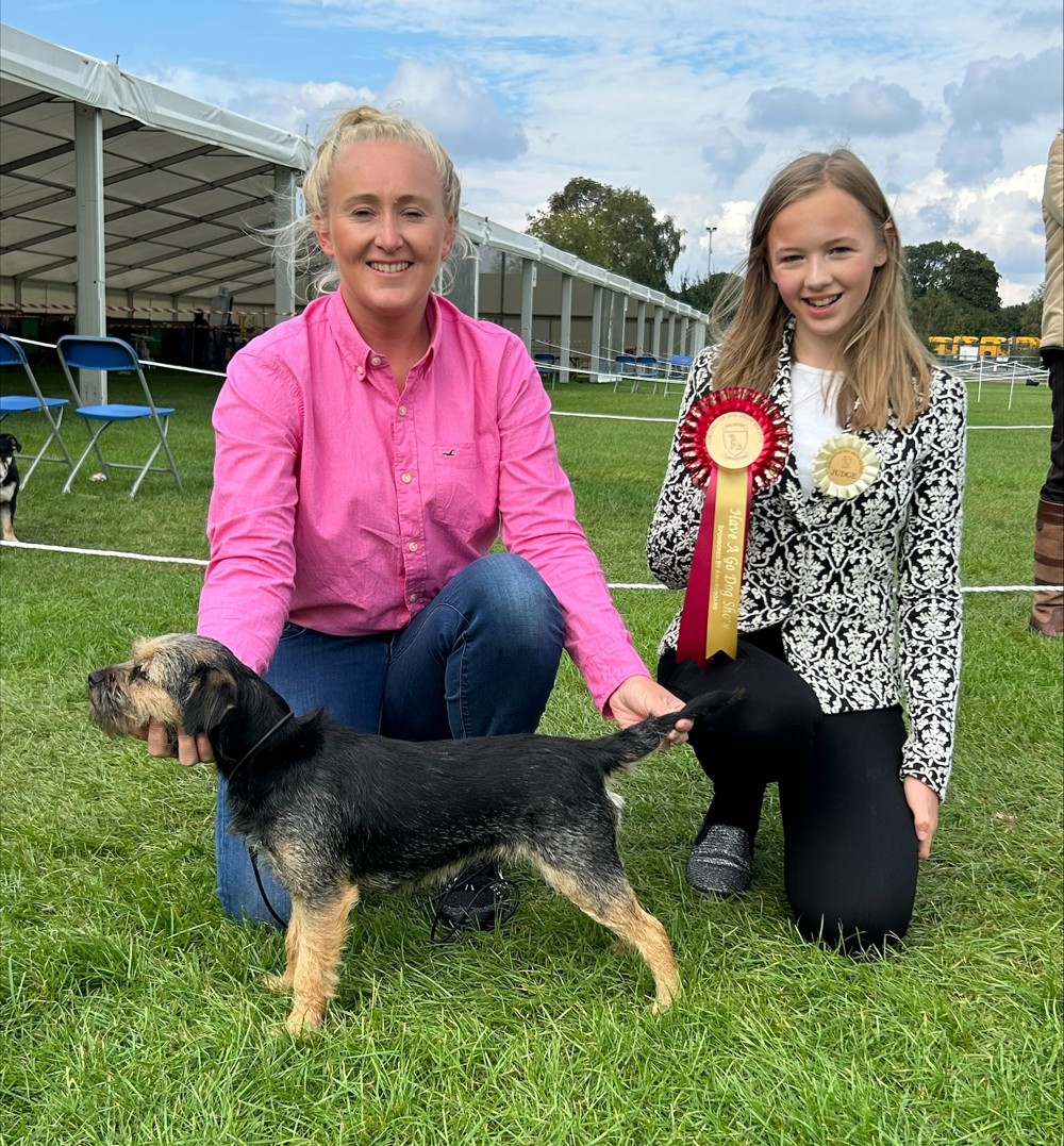 Tammy Blackburn and Border Terrier with judge, Lena Tate