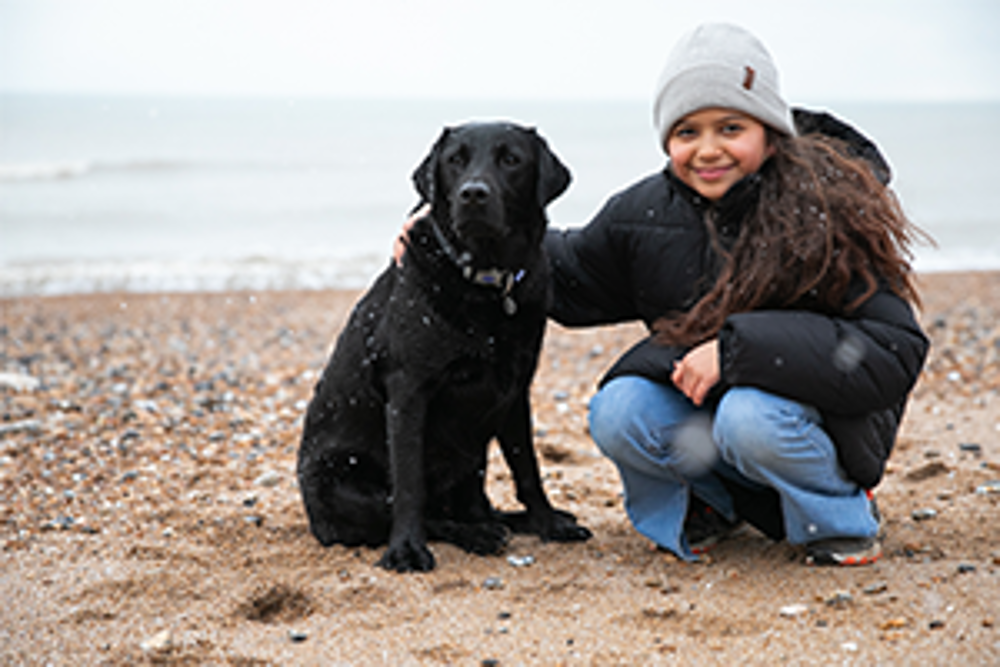 Child’s champion – hearing dog Gordon, and his young owner, Elyana | Kennel Club Hero Dog Award
